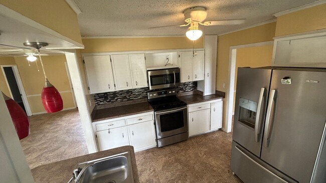 Building Photo - Renovated 5 Bedroom 3 Bath Home with 2 Car...