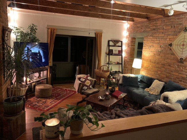 Living room at night with porch doors open - 1321 Hunter Ave