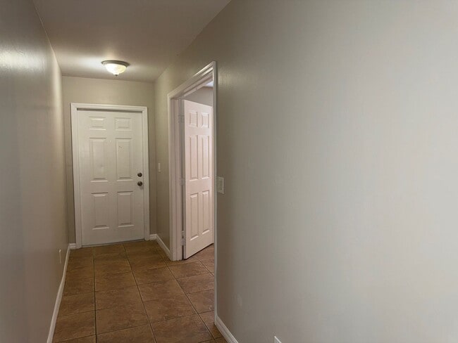 Building Photo - Experience this Cape Coral 3 bedroom 2 bath corner duplex with 1 car garage and screened in lanai.