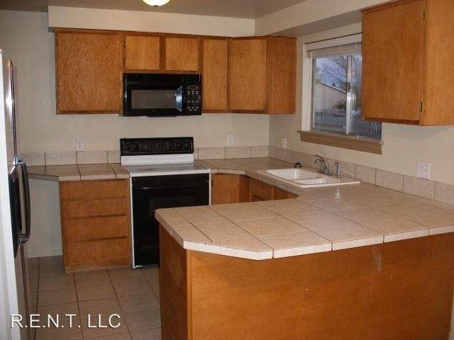 Building Photo - 4 br, 2 bath House - 4939 W. Silvertip Drive