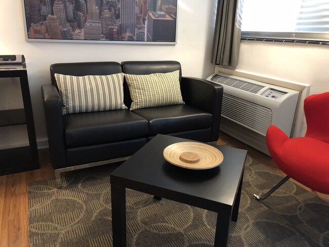 Corporate Rentals New Sofas in Sitting Area Studios On 25th - Furnished Studio Apts. (NTLY/WKLY/MTHLY)