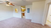 Located at 945 N Broadway St in Greenville, Mississippi, this single-story, 2-bedroom, 1-bathroom home offers a functional and straightforward layout. The combined kitchen and living area serves as the heart of the home, with soft carpeting in the living space and a large window that invites natural light. A ceiling fan provides year-round comfort, while a dedicated entryway with tile flooring marks the transition into the living area. An electrical panel is conveniently accessible from this shared space.

The kitchen is efficiently designed with warm oak cabinetry, light-toned countertops, a stainless steel sink, and white appliances including a refrigerator, dishwasher, and range. Tile flooring runs throughout the kitchen, which also features washer/dryer hookups, offering added convenience.

Both bedrooms are carpeted and feature ceiling fans with light fixtures and windows with blinds that provide outdoor views and natural light. The primary bedroom includes a closet, adding practical storage. A hallway connects the rooms to the full bathroom, which is equipped with a shower/tub combo and a vanity with matching oak cabinetry and light countertops. Clean, neutral wall tones throughout the home create a bright and move-in ready environment.