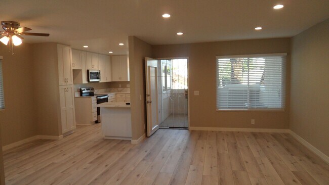 Foto del edificio - REMODELED 2BR; 2BA end unit condo with 1 car garage & 1 parking space