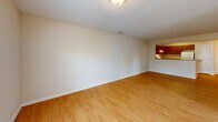Located at 500 Big Forrest Ct in Newport News, Virginia, this single-floor, 2-bedroom, 1-bathroom home offers a practical and comfortable layout. The combined kitchen and living room area forms the heart of the home, with warm hardwood-style flooring extending throughout the main living spaces. The living room provides an open, versatile area, connected to the kitchen via a pass-through window that adds a functional, open feel. The kitchen is outfitted with rich wood-toned cabinetry, ample counter space, a double sink, and white appliances including a range and refrigerator, all set atop matching hardwood-style flooring.

Both bedrooms feature soft, neutral-toned carpeting and windows fitted with blinds that allow for natural light while maintaining privacy. The primary bedroom includes a ceiling fan with light fixture, while the second bedroom also features a ceiling fan and a double-door closet for convenient storage. The bathroom is equipped with a tub and shower combination. A hallway connects the bedrooms to the main living areas, and neutral, warm beige tones are carried throughout the home, contributing to a cohesive and inviting ambiance.