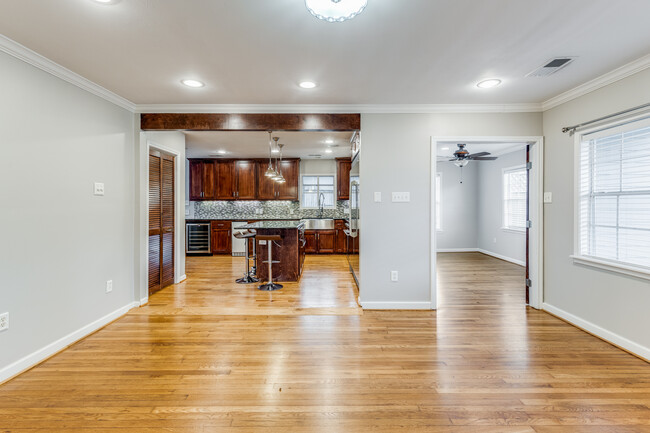 view of "bonus" room next to kitchen. Icemaker and wine fridge in kitchen - 4035 Oak Ridge St