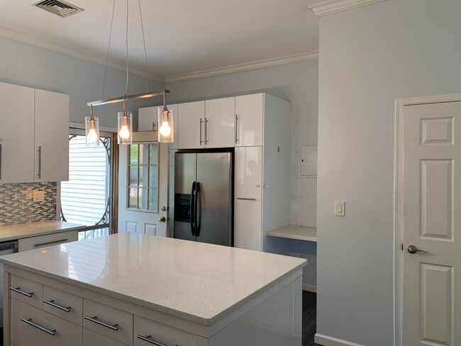 Kitchen w/backdoor open - 514 23rd St