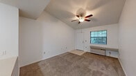 Located at 1501 Shepherd Rd in Lakeland, FL, this one-bedroom, one-bathroom unit offers a thoughtfully arranged single-floor layout. The combined living and dining area is a welcoming, open space featuring vaulted ceilings, a ceiling fan with light fixture, soft carpeting, and a window that brings in natural light with views of surrounding greenery. A wall unit provides climate control, and tile flooring marks the entryway transition.

The kitchen is efficiently designed with white cabinetry, tile backsplash, light countertops, a double-basin sink, electric range, dishwasher, refrigerator, and built-in microwave. A curved breakfast bar connects the kitchen to the living area, enhancing the open feel. A pantry provides additional storage.

The bedroom is a comfortable retreat with plush carpeting, a ceiling fan, a window with blinds, and a closet with bi-fold doors. The full bathroom includes tile flooring, a jetted soaking tub with a tiled shower surround, a toilet, and a single vanity with sink.

A dedicated laundry room houses a full-size washer and dryer with overhead shelving. Two closets provide ample storage throughout. The clean, neutral palette creates a bright and functional living environment.