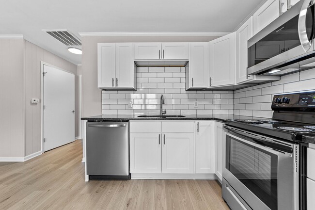 Building Photo - Gorgeously Renovated Apartments - Warm up ...