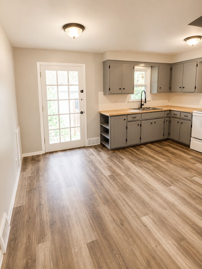 Building Photo - Charming 3BR Rental with Extra Living Space in Basement