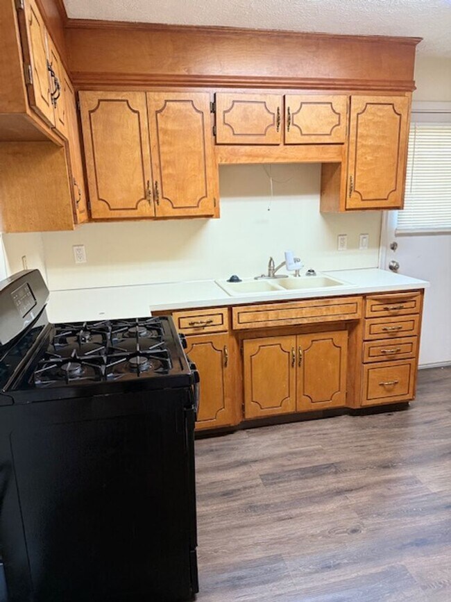 Building Photo - Comfortable Corner-Lot with Main Floor Pri...