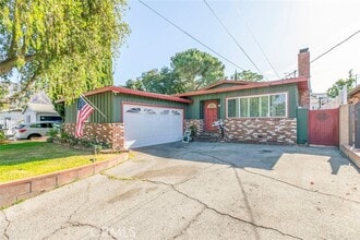 Building Photo - 10706 Rhodesia Ave