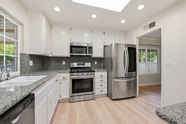 Building Photo - Bright, Charming & Garden-Filled