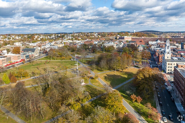 An aerial overview of Lawrence, MA, and its Campagnone Common Park in the foreground.