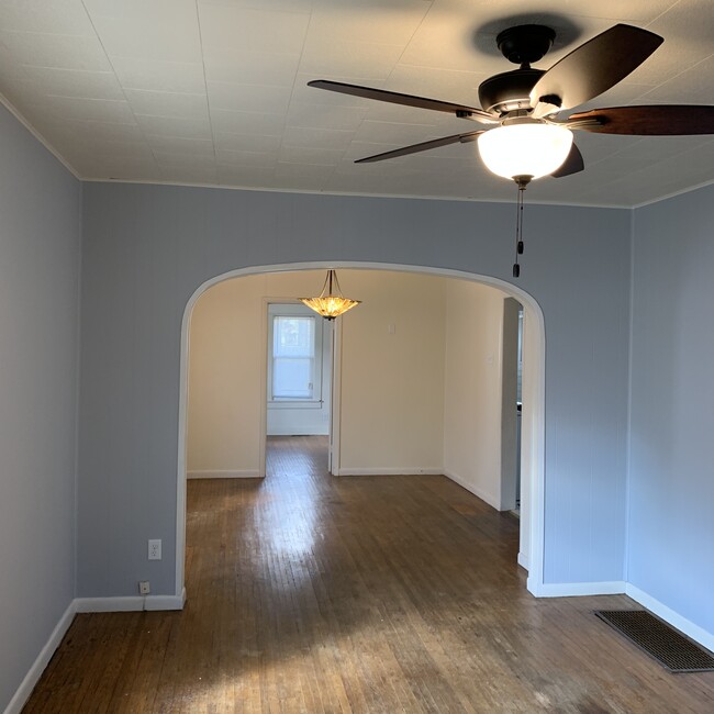 Living room looking into dining room and back bedroom - 303 E Vermilya Ave