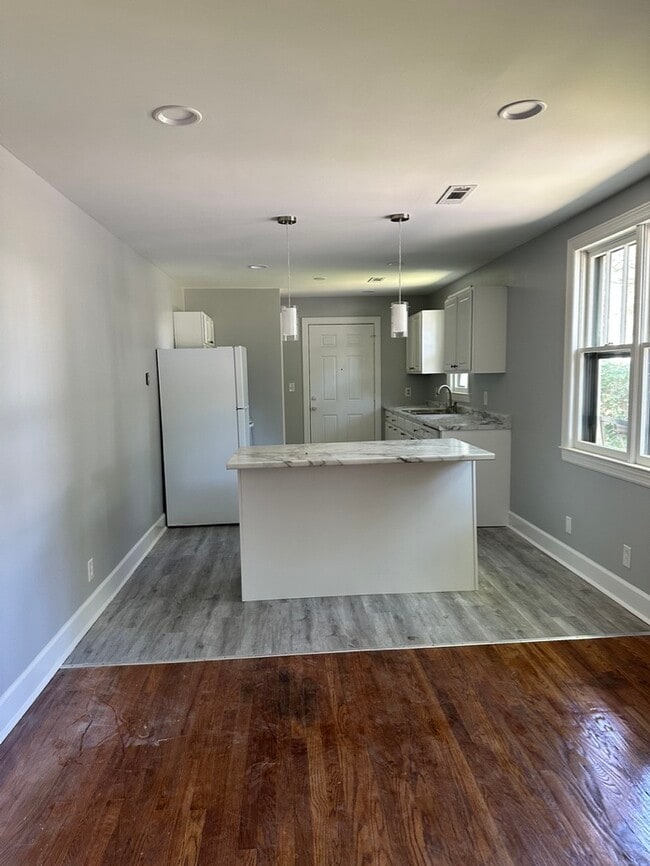 Open kitchen/den concept. - 1826 River Dr House