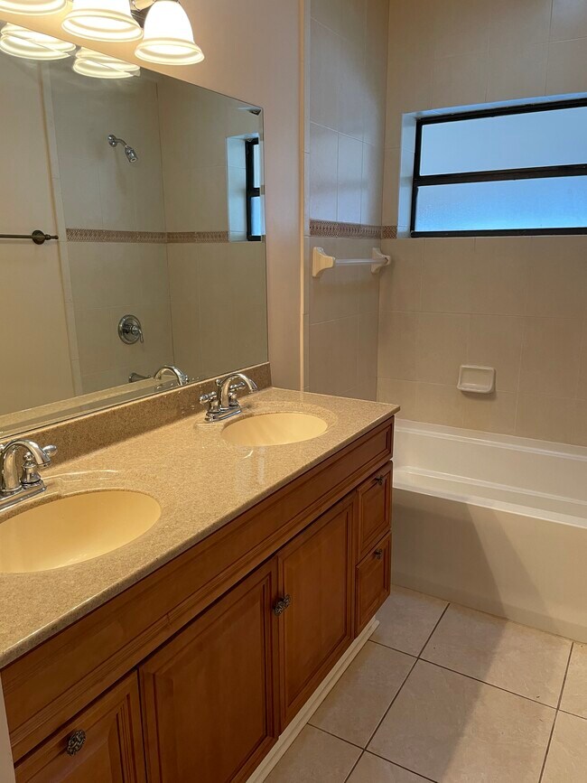 Master bath with double sinks. - 3005 W Sligh Ave