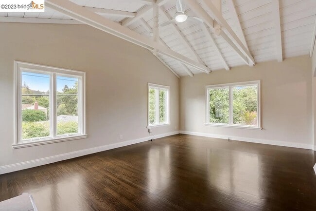 Living room with high ceilings and exposed beams - 2 Morrill Ct