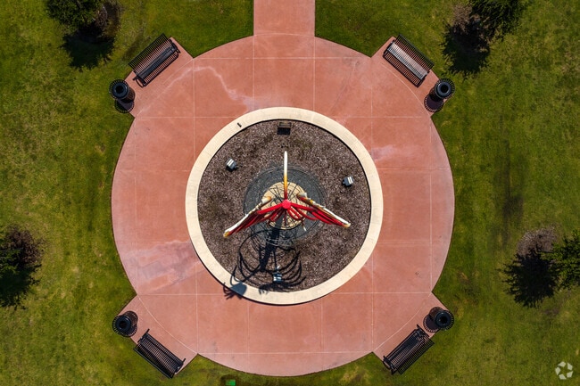 Encircling the Spirit of Rowlett at Schrade Bluebonnet Park are benches to admire the art.