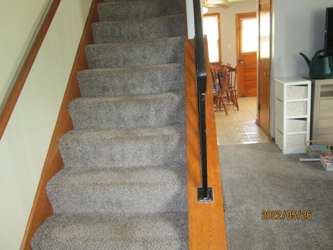 stairs to 2nd floor showing dining area in kitchen - 3936 Liberty St