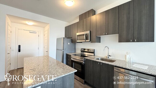 Photo du bâtiment - Modern 1+Den Condo in Milton – 695 Sq Ft w...