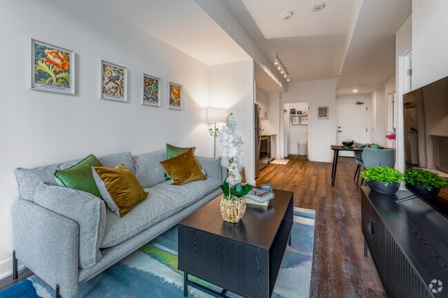 1BR + Den, 2BA - 734SF - Living Room - 3030 Pharmacy Avenue