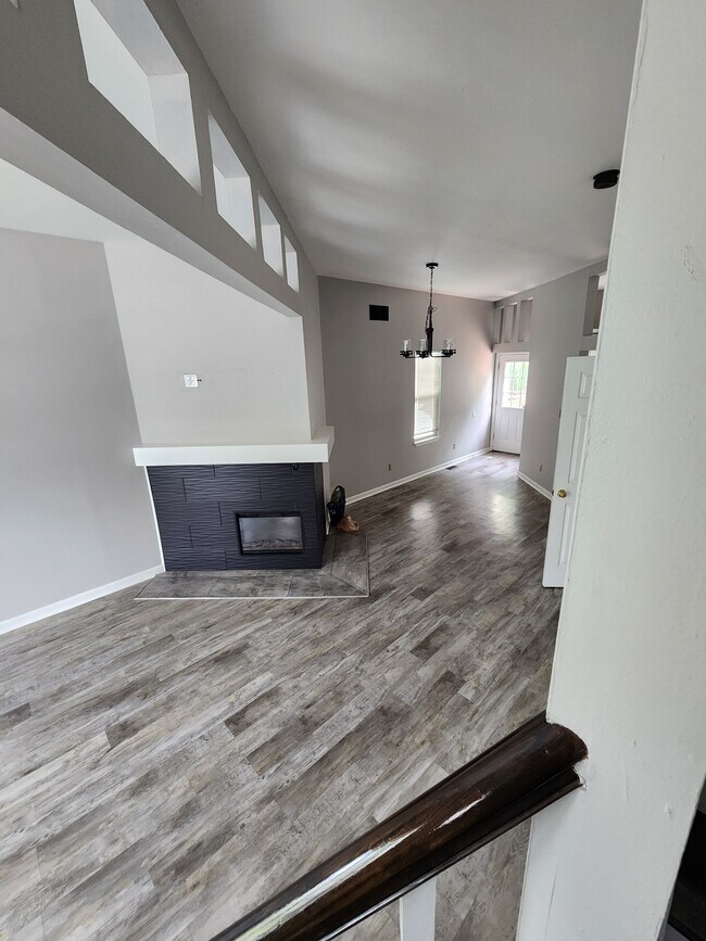 Livingroom with electric fireplace and outlet for television above. - 3418 Caroline St
