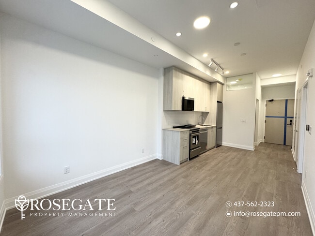 Building Photo - Modern 1 Bedroom + Den (Potential 2nd Bedroom) Condo with Parking & Balcony
