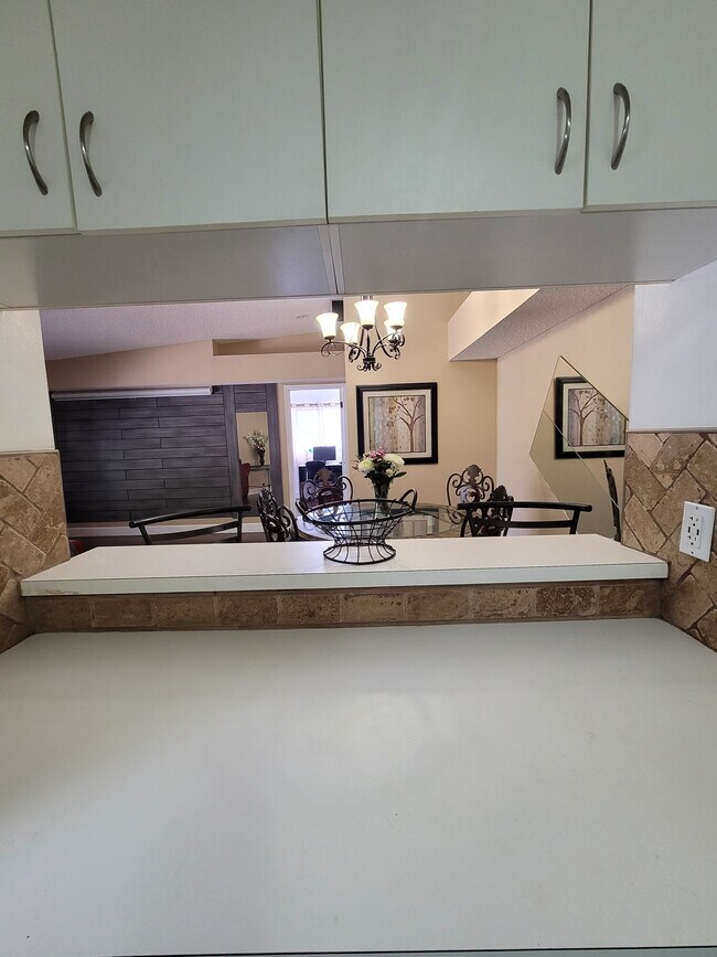 Bar visual from kitchen out to dining area, where people can be easily served from the kitchen! - 19800 SW 103rd Ct