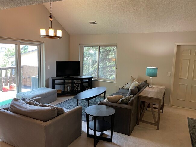Big windows make the home feel like a treehouse! Vaulted ceiling is special in such a home. - 4475 Laguna Pl