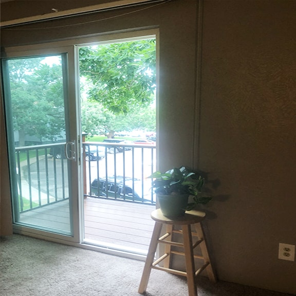 Bright and Cheery, Living room and Dining Room Leading to Your Private Deck and Vew of the Mountains - 16259 W 10th Ave