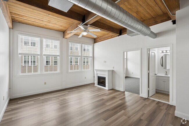 2 habitaciones, 2 baños - 805 pies cuadrados - Sala de estar - Emerson Shoe Lofts