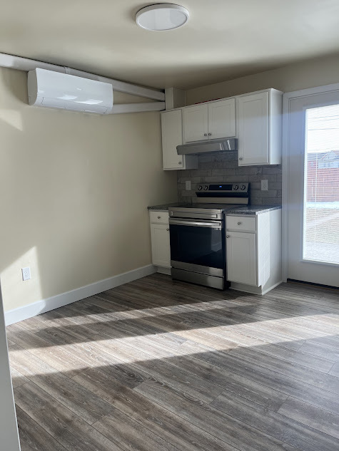 Kitchen with new stove and range fan - 122 3rd St