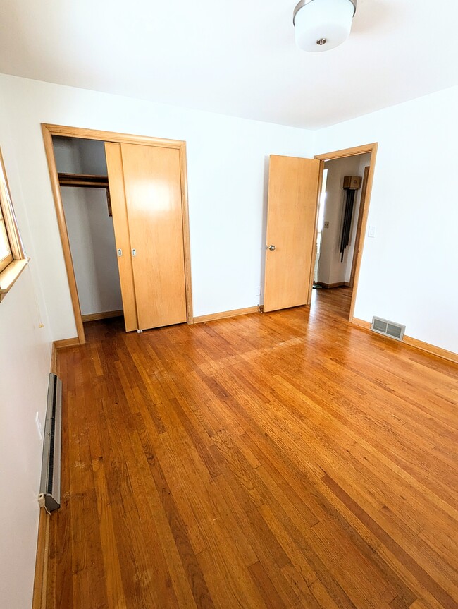 The second bedroom offers space and a flood of natural light as well as a spacious closet. - 910 Maple St