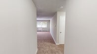 Located at 18 N Turnpike Rd in Wallingford, CT, this one-bedroom, one-bathroom unit offers a practical and well-organized single-floor layout. The living room is a comfortable, carpeted space filled with natural light streaming through large windows fitted with blinds, complemented by a baseboard heating system. A textured ceiling adds character to the area.

The kitchen features warm oak cabinetry with ample upper and lower storage, a curved countertop with a built-in sink, tile flooring, and a ceiling fan overhead, creating a functional and efficient cooking space.

The bedroom is a generously sized, carpeted retreat equipped with a ceiling fan and a closet for convenient storage. The room receives good natural light and offers a calm, neutral ambiance.

The full bathroom is clean and well-appointed, featuring tile flooring, a white vanity with sink, a toilet, and a full tub-shower combination with white tile surround.

Notably, the unit includes three closets in total, providing excellent storage capacity throughout. The neutral color palette, soft carpeting in the main living areas, and consistent finishes create a cohesive and move-in-ready environment throughout the space.