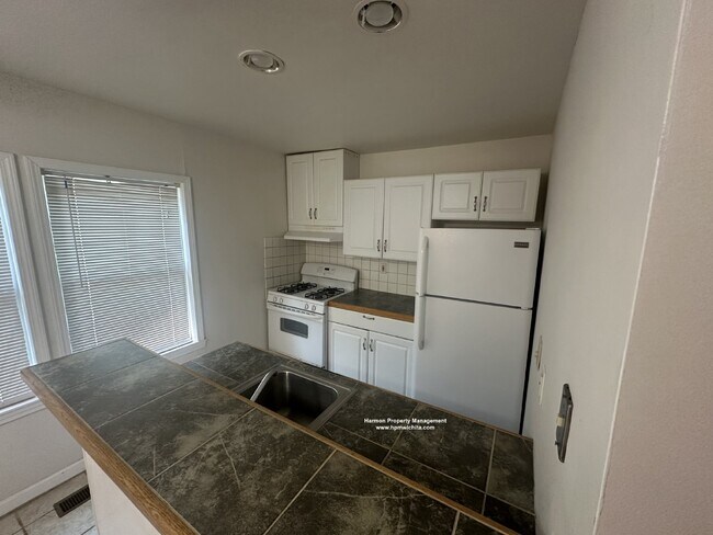 Building Photo - Two Bed One Bath Upstairs Apartment Within...