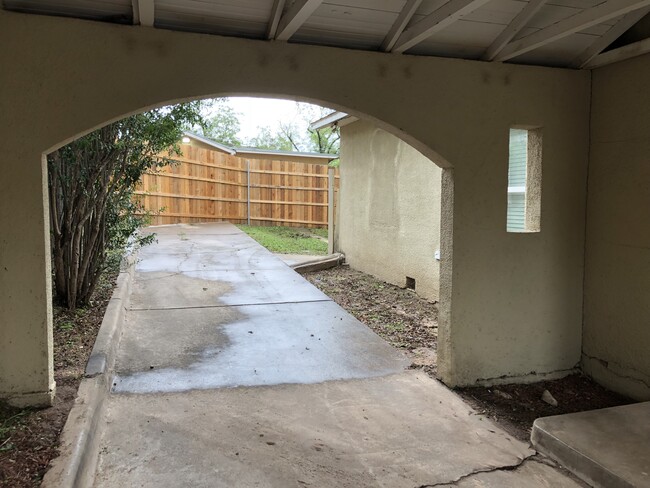 Picture taken standing under the covered parking looking into the backyard - 418 S. Washington Street