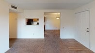 Located at 50 Rocky Creek Rd in Greenville, South Carolina, this single-floor residence offers a well-designed layout with a variety of comfortable living spaces. The living room is a welcoming focal point, featuring a classic fireplace, a ceiling fan with integrated lighting, and plush carpeting throughout. A sliding glass door opens to a private balcony, allowing natural light to fill the room and offering pleasant outdoor views.

The kitchen is efficiently arranged with rich wood cabinetry, granite-style countertops, wood-look flooring, and black appliances including a range and refrigerator. A convenient pass-through window connects the kitchen to the adjacent living and dining areas, enhancing the open flow of the home.

The bedrooms are carpeted and generously proportioned, each offering ample closet space. The rooms are bright, with windows admitting natural light, and ceiling fans provide year-round comfort.

The primary bathroom is a standout feature, boasting a dual-sink vanity with granite-style countertops, rich wood cabinetry, wood-look flooring, a soaking tub, and a separate glass-enclosed shower. A secondary full bathroom mirrors the same design aesthetic, complete with wood-look flooring, a single vanity with granite-style countertops, and a tub-shower combination. Together, these spaces provide a functional and cohesive living environment.