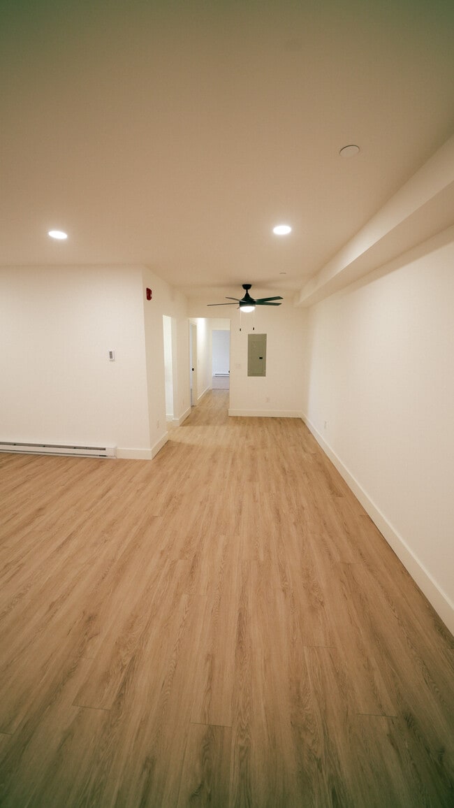 Wide view of living and dining space - Southgate Gardens Apartments