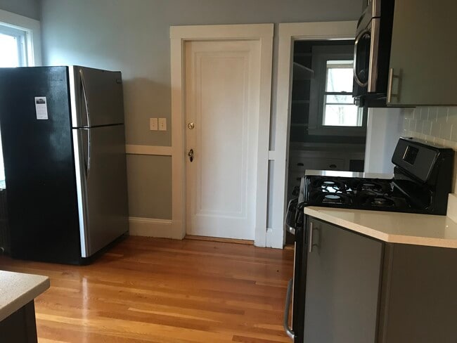 Kitchen with refrigerator, access to back entrance and pantry - 9 Coniston Rd