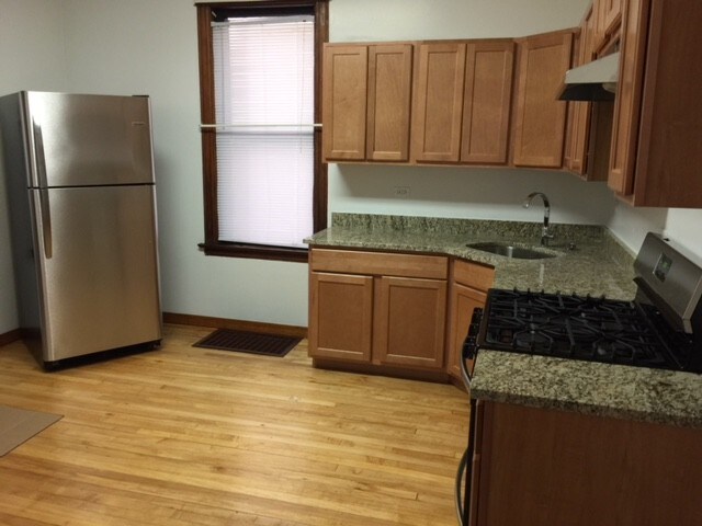 New kitchen with GRANITE TOPS and stainless steel appliances - 3748 W Lyndale St