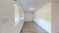 Located in St. Petersburg, FL, this single-story, four-bedroom, one-bathroom home offers a practical and efficiently designed layout. Throughout the home, light-toned vinyl plank flooring creates a clean, cohesive look, while crisp white walls and white trim contribute to a bright, open ambiance. Each of the four bedrooms is equipped with a ceiling fan and features generous natural light from windows with views of surrounding greenery. The spacious primary bedroom includes built-in closet storage, while additional bedrooms offer comparable comfort and simplicity. One bedroom features darker vinyl flooring, adding a subtle contrast to the overall aesthetic. The galley-style kitchen is a standout feature, showcasing white shaker cabinetry with brushed nickel hardware, light stone countertops, a tile backsplash, stainless steel appliances including a refrigerator and range, and recessed lighting overhead. The full bathroom includes a tiled tub-and-shower combination. A hallway connects the main living areas, and a dedicated closet provides additional storage. The home's layout, as seen in the dollhouse view, is compact yet well-organized, making efficient use of its footprint.