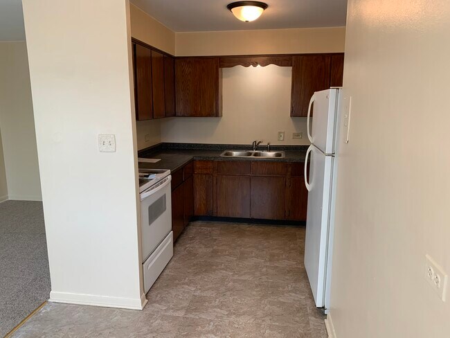 Kitchen with stove and fridge - 1246 S 51st Ct