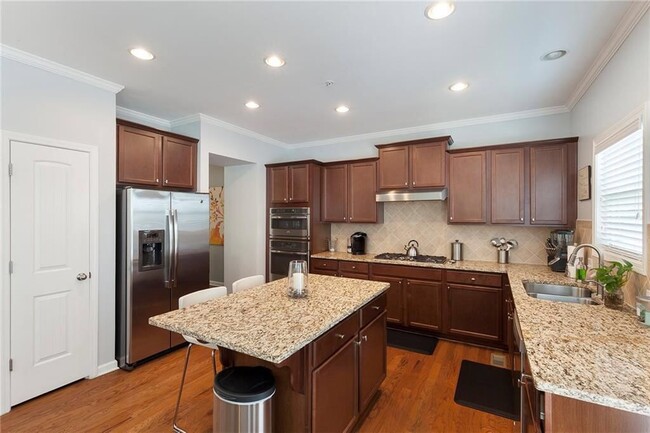 open kitchen with large island - 3491 Vintage Cir SE