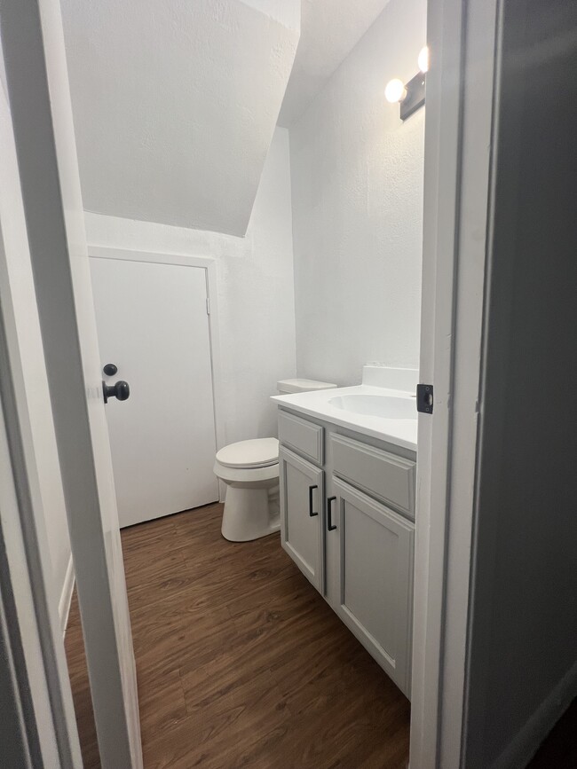 Downstairs 1/2 Bath with under stair storage - 9010 Sedgemoor Trl