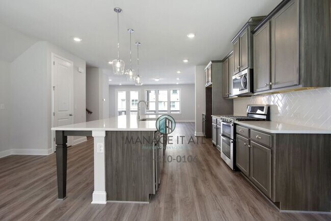 Foto del edificio - Modern 3-level Townhome featuring 4 bedroo...