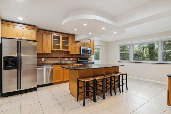 Building Photo - 5 BR 4.5 BA home with inground heated pool and extensive hardscape!