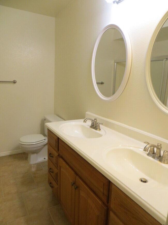 Master bath has shower, double sinks, tile floor. - 3602 W Estates Ln