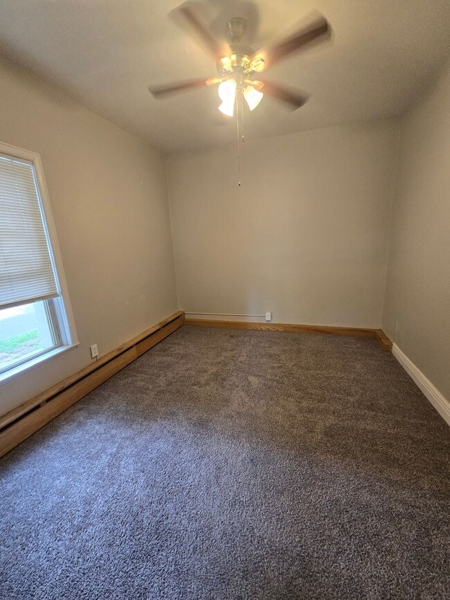 Building Photo - This updated and welcoming condo in the he...
