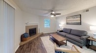 Located at 1500 S Jupiter Rd in Allen, TX, this single-floor residence offers a well-organized layout designed for comfortable everyday living. The living room serves as the heart of the home, featuring a tile-surround fireplace, wood-look flooring, a ceiling fan, and a window that brings in natural light, creating a warm and inviting atmosphere. The open-concept kitchen is equipped with white cabinetry, black appliances, granite-look countertops, and a peninsula with bar seating — ideal for casual dining and entertaining. A dedicated dining nook adjacent to the kitchen provides additional space for meals. The home includes multiple bedrooms, each carpeted for comfort and outfitted with sliding-door closets for ample storage. The bedrooms are bright and well-proportioned, with windows allowing natural light to filter in. The bathroom features a shower-tub combination with neutral finishes. A dedicated in-unit laundry area accommodates a full-size washer and dryer side by side, adding everyday convenience. Neutral wall tones and consistent flooring throughout the home create a cohesive and move-in-ready aesthetic. The overall ambiance is clean, functional, and welcoming, suited for a range of lifestyle needs.