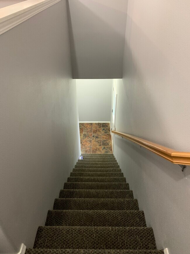 Stairs to garage and gated patio - 1661 NE Market Dr